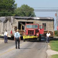 The blacksmith shop building moving to the Sonnenberg Village turning onto Hackett Rd.