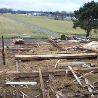 site after dismantling of barn